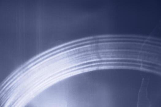 Abstract image with soft-focus dark blue sunlight light patterns as light waves, festive texture background, blurred backdrop trend color year 2025, white sunlight glare on future dusk rainbow photo