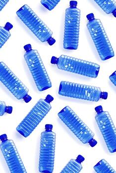 Patterns from Clear plastic water bottles with blue cap on white background with soft shadow, Minimal top view, themes of ecology, recycling, sustainable living, reduce disposable plastics concept photo