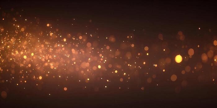 Golden sparkling bokeh lights illuminate a dark abstract background creating a magical festive atmosphere photo