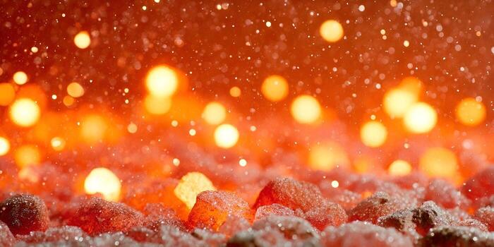 A vibrant abstract background features sparkling particles over a warm red and orange bokeh light display and glowing textured elements below photo