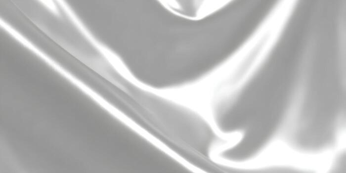 Smooth luxurious white silk fabric with elegant flowing curves and shiny reflections creating an abstract background texture photo