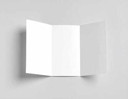 Blank tri-fold brochure on light gray background photo