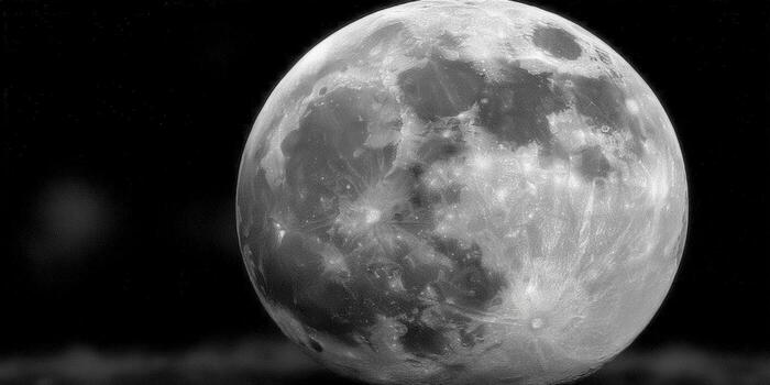 The moon in all its glory, displaying its detailed surface and casting an otherworldly glow. photo