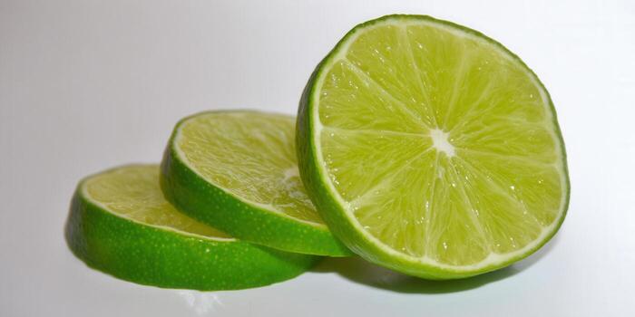 Three slices of a fresh lime, perfect for adding a zesty touch to any dish or beverage. photo