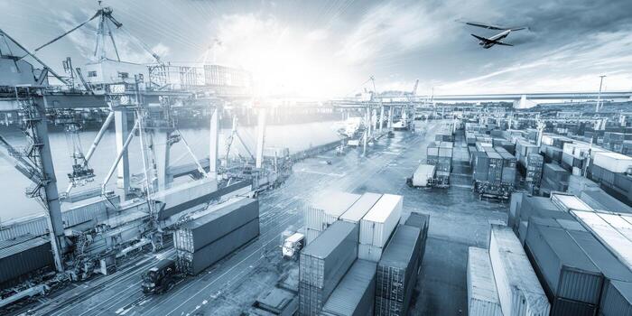 vívido aéreo perspectiva de un ocupado puerto, lleno con contenedores, buques, y carga operaciones, presentando un avión. foto