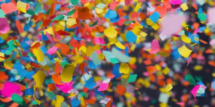Colorful confetti floats, creating a vibrant and festive background for celebrations and events. photo