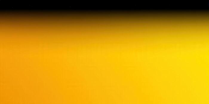 This abstract image showcases a warm gradient of yellow and orange hues. photo