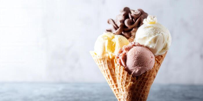 Variety of ice cream scoops on a cone, a delightful dessert for all. photo