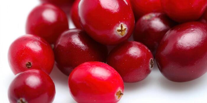 A close-up of a pile of fresh, red cranberries ready for a delicious treat. photo