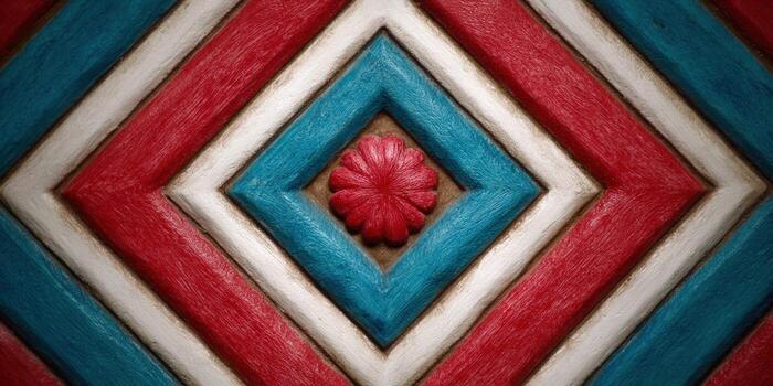 Intricate wooden surface featuring a geometric pattern with red, white, and blue colors and a central flower photo