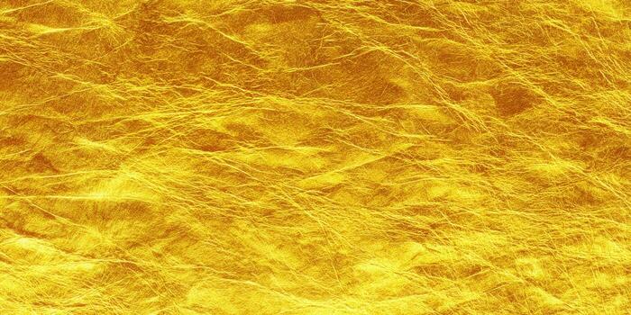 A detailed view of a golden, textured surface, perfect for backgrounds and design elements. photo