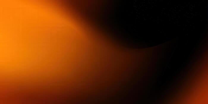 A captivating abstract gradient featuring a blend of warm orange and black colors. photo