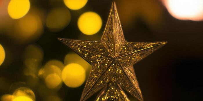 Golden christmas star with bokeh lights in the background photo