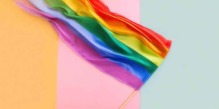 A colorful rainbow pride flag waving against a serene pastel backdrop, symbolizing equality and support. photo