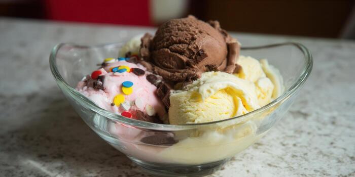 A tempting bowl of colorful ice cream with various delightful flavors. photo