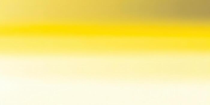 This soft, yellow gradient background is perfect for adding a touch of warmth and style to any project. photo