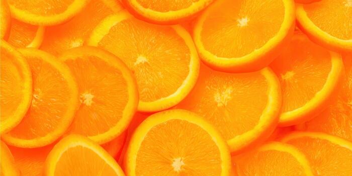 A close-up of freshly sliced oranges creating a vibrant and appetizing composition. photo