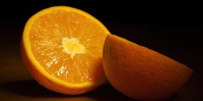 A close-up shot of a sliced orange, showcasing its vibrant color and juicy texture. photo