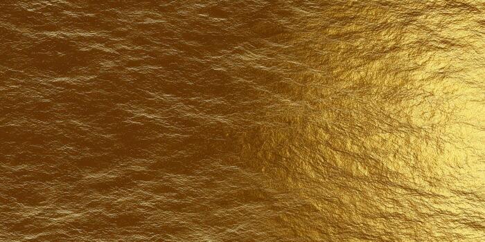 This image shows a close-up of a golden, textured surface with a shiny appearance. photo