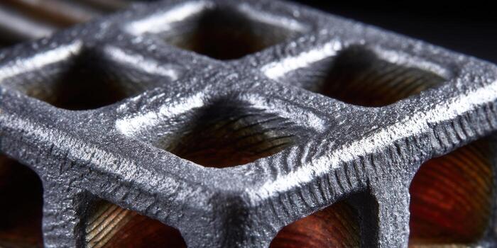 Intricate metal lattice structure displayed with an industrial and geometric design. photo