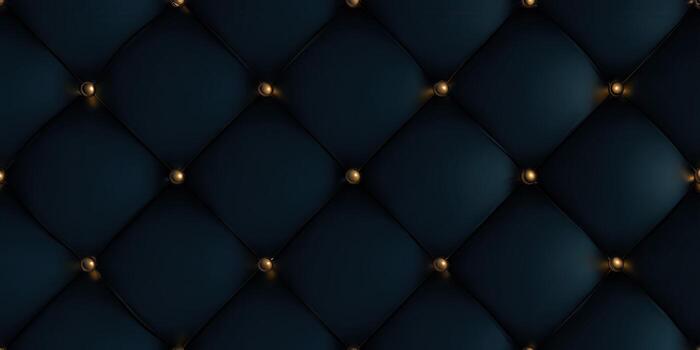 A close-up view of a tufted, dark blue leather texture with gold buttons. photo