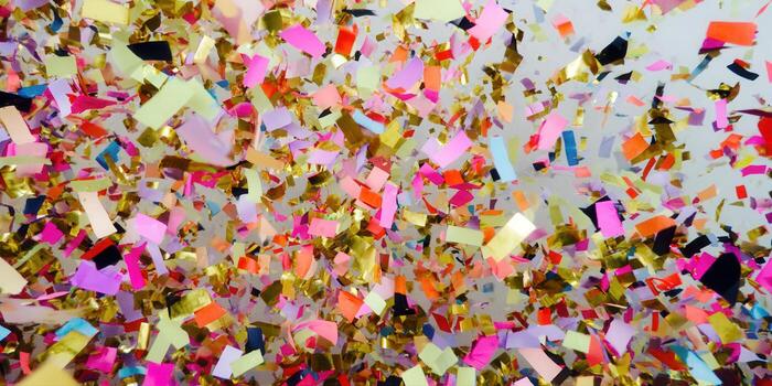 Colorful confetti bursts across the image, adding a touch of celebration and fun for any occasion. photo