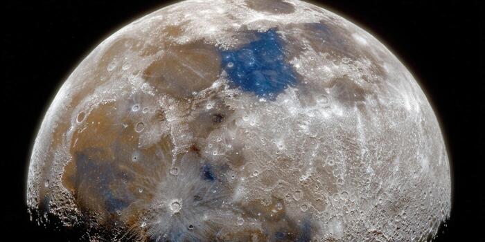 Detailed image of the moon with visible craters and textures against the blackness of space. photo