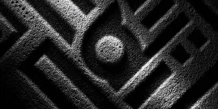 A complex maze design in contrasting black and white, creating an intriguing geometric pattern. photo