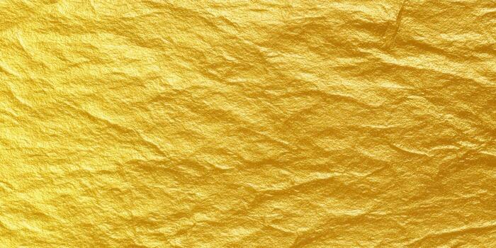 A close-up view showcases a textured golden surface with a luxurious and rich appearance. photo