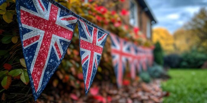Union Jack bunting flags decorate a garden during autumn, creating a patriotic scene. photo
