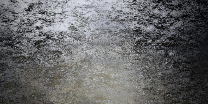 Textured surface with a gradient of light and shadow, creates a visual interest and sense of depth. photo