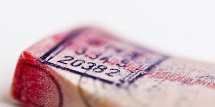 Close-up shot of a cork with printed numbers and a stamp in soft focus. photo