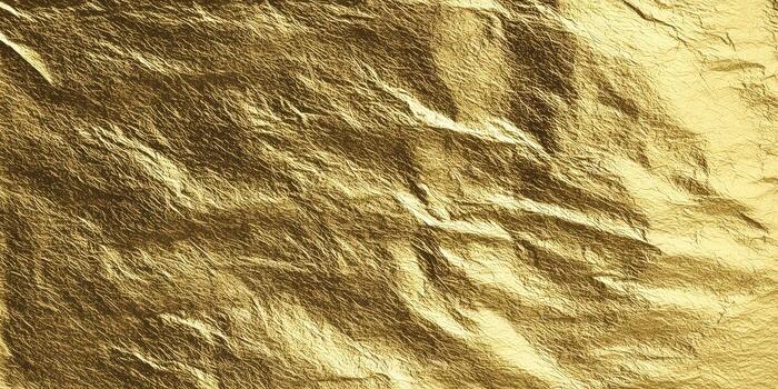 Detailed view of golden foil paper, perfect for adding a touch of luxury to any design. photo