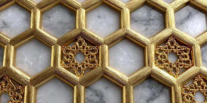 Ornate golden hexagon pattern with intricate details and a luxurious marble backdrop. photo