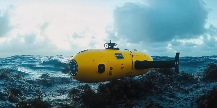 The bright yellow submarine navigates through the ocean waters, ready for exploration. photo