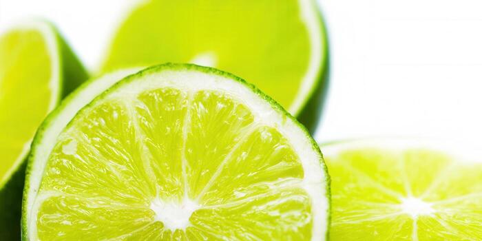 Fresh lime slices, a close-up image showing detail and freshness on a white background. photo