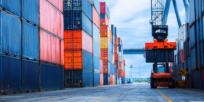 Shipping containers stacked high in a bustling port, ready for global transport and trade. photo