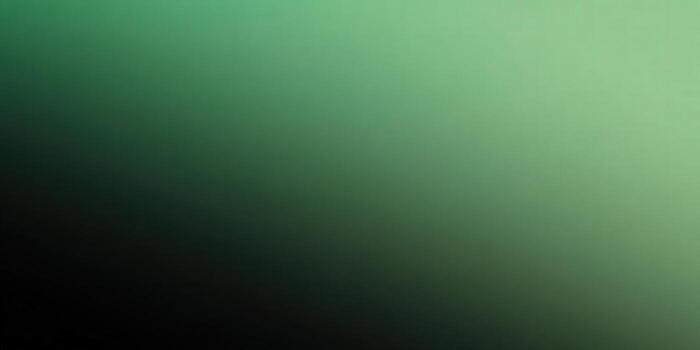 This abstract gradient background showcases a blend of dark and light green hues. photo