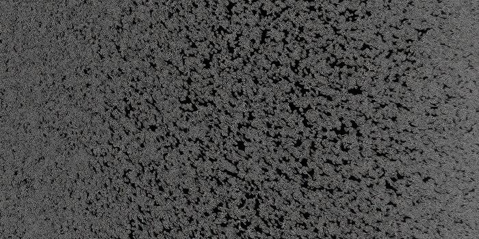 A close-up view of rough asphalt texture, forming a dark gray background. photo