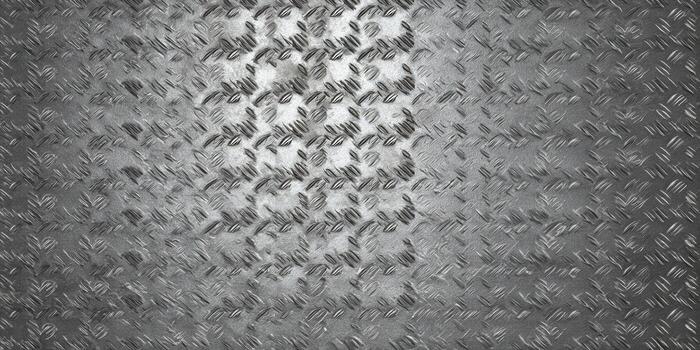 A detailed shot of a diamond plate metal texture with a repeating pattern. photo