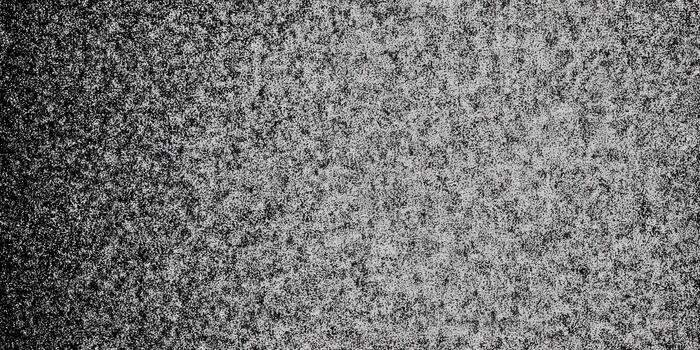 A detailed gray speckled texture with a gradient for backgrounds and designs. photo
