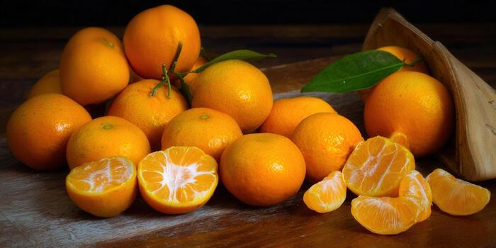 Close-up of juicy tangerines, displaying their bright orange segments on a rustic wood surface. photo