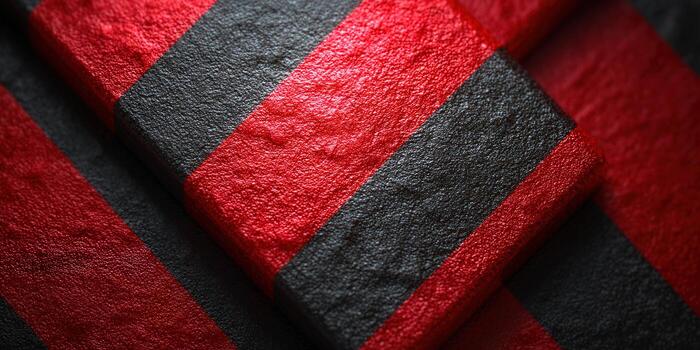Striking abstract image featuring bold red and black textured stripes. photo