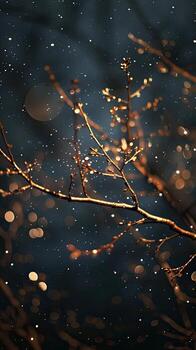 A tree branch with lights and snow falling photo