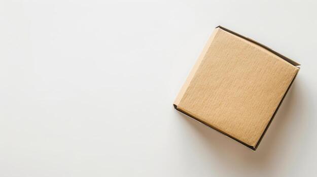 An empty cardboard box on a white surface photo