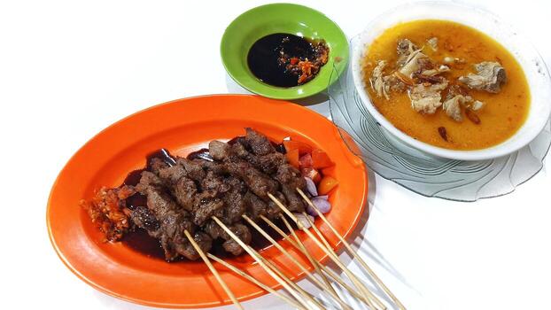 Sate Kambing with Gule Soup and Soy Sauce, Indonesian Lamb Skewer Dish. Isolated on White Background photo