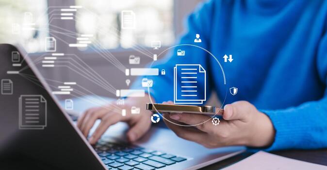 Businesswoman working on laptop with virtual screen Online documentation database, IT consultant being set up Virtual Document Management System with a laptop, Software for archiving corporate files. photo