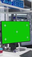 Vertical Mockup display on monitor running in empty research facility with advanced lab equipment for molecular analysis and pharmacology. Bioscience setting reflects discovery and scientific precision. video