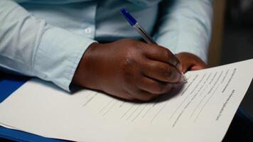 Close up of candidate filling in registration forms for job application and interview, ensuring a great recruitment process and successful meeting with the HR. Writes down qualifications. Camera B. video