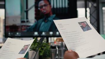 Confident job seeker joining virtual call interview with human resources staff via remote connection, discussing about qualifications in order to fill in the position, career opportunity. Camera B. video